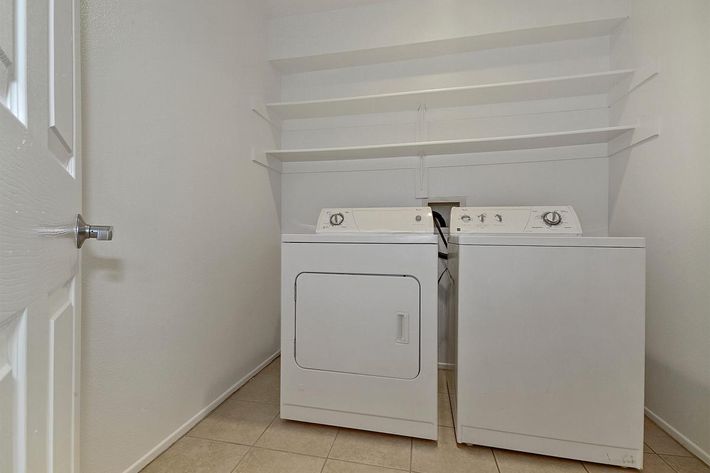 Washer and dryer with tile flooring