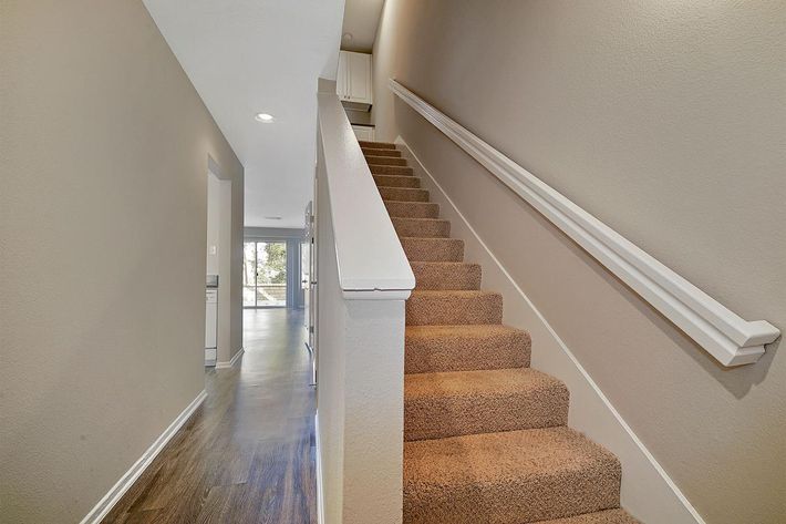 Carpeted stairs to the second floor