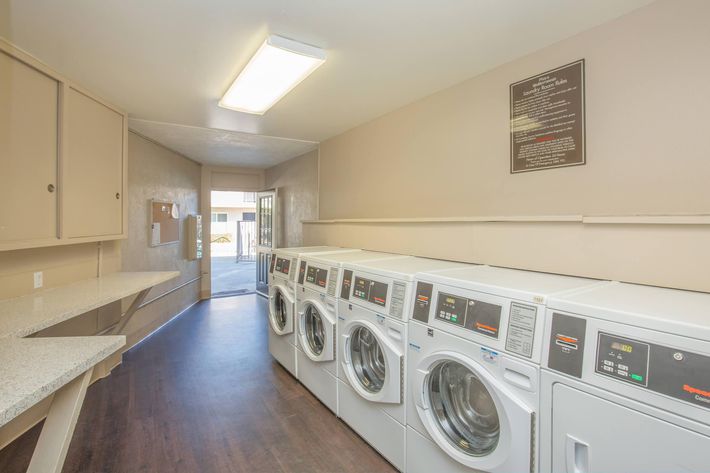 Washers and dryers in community laundry room