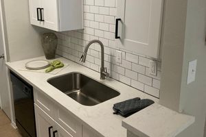 a close up of a sink in a kitchen