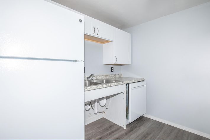 a large white refrigerator in a kitchen
