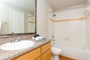 unfurnished bathroom with wooden cabinets