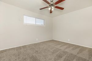 unfurnished bedroom with a ceiling fan