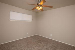 carpeted bedroom with a ceiling fan