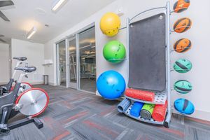 various yoga mats and balls in the community gym