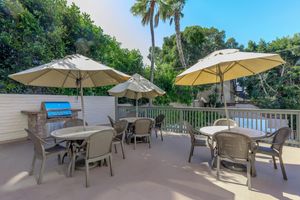 San Diego CA Apartments - Casa Del Norte Apartments - BBQ Grill Area with Umbrella Table Seating