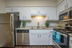 a kitchen with a stove top oven