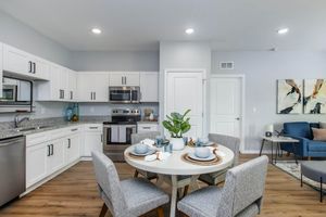 a kitchen with an island in the middle of a room