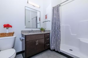 a room with a sink and a mirror