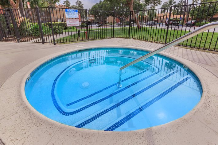 a pool next to a fence