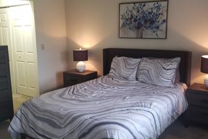 a bedroom with a bed in a hotel room