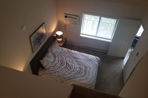 a bedroom with a bed in a dark room