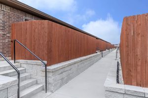 a building with a wooden fence