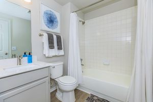 a room with a sink and a shower