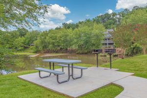 Stocked Pond and Designated Fishing Deck - Lakeside Place Apartments - Greenville - South Carolina