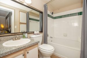a furnished bathroom with granite countertops