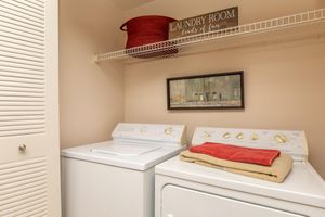 a washer and dryer in the laundry closet