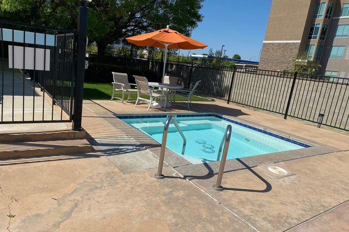 a pool next to an umbrella