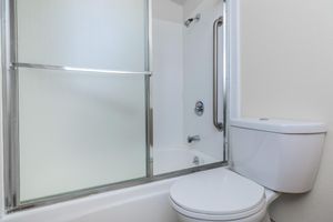 Unfurnished bathroom with a glass shower door
