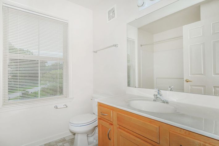 a room with a sink and a window