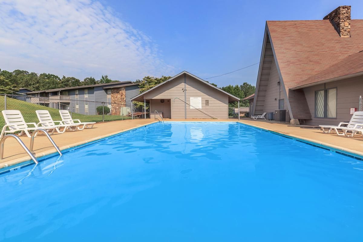 a house with a large pool of water