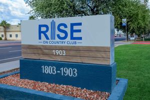 Rise on country club sign