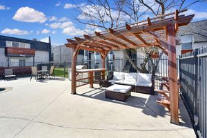 a pergola with a white couch