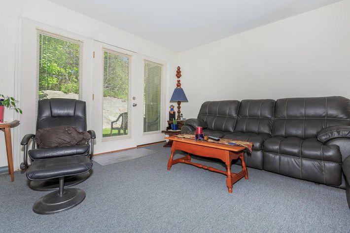 a living room with a leather chair