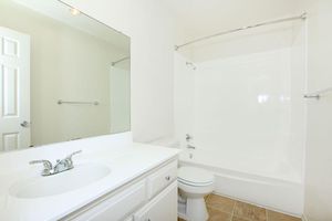 Vacant bathroom with laminate floors