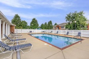 Lounge by the pool at Lakeshore Crossing Apartments