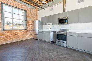 a kitchen with a stove top oven sitting inside of a building