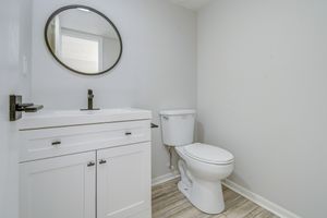 Vanity and toilet in townhome platinum bathroom interior at The Arbor in Blue Springs, Missouri