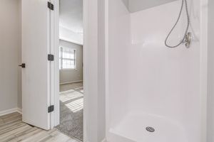 Standing shower inside platinum bathroom interior at The Arbor in Blue Springs, Missouri