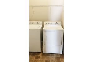 Laundry closet with a washer and dryer