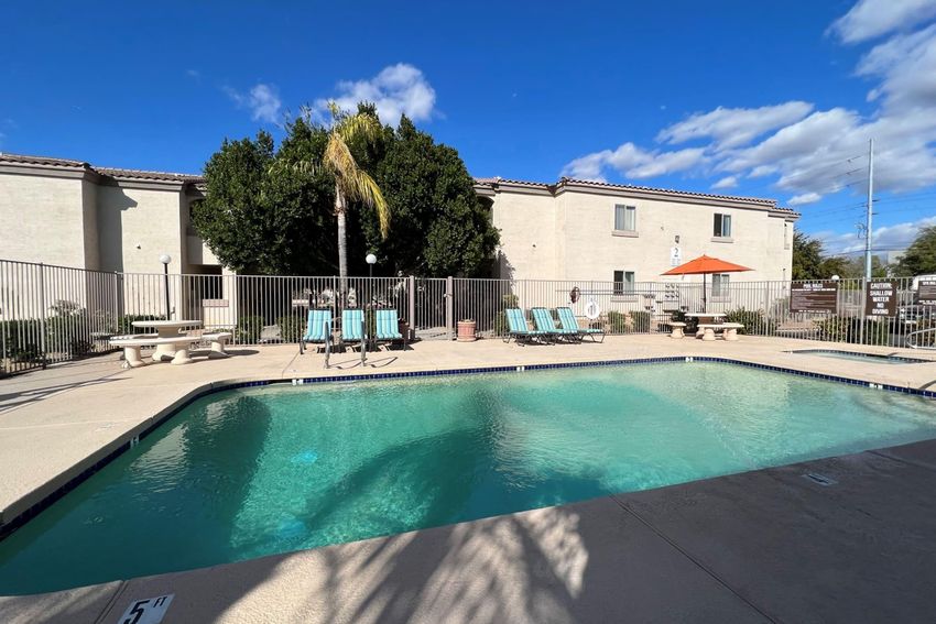 Pool and poolside area at Deer Valley Regency Apartments.