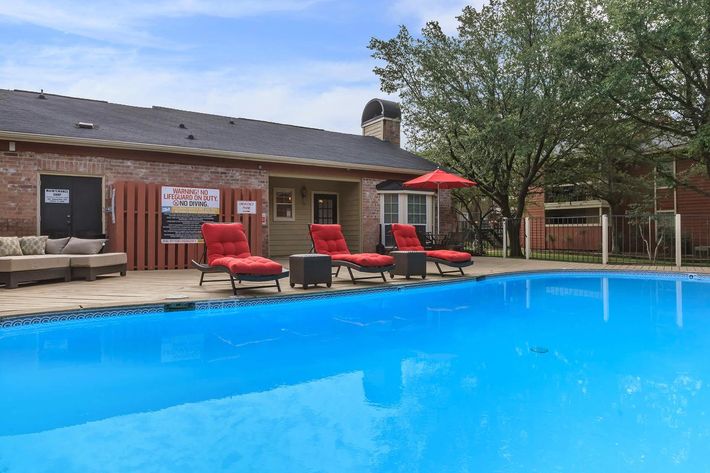 Comfortable lounge seating by the pool at The Park at Summerhill Road