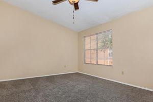 Large carpeted room with ceiling fan at The Park at Summerhill Road