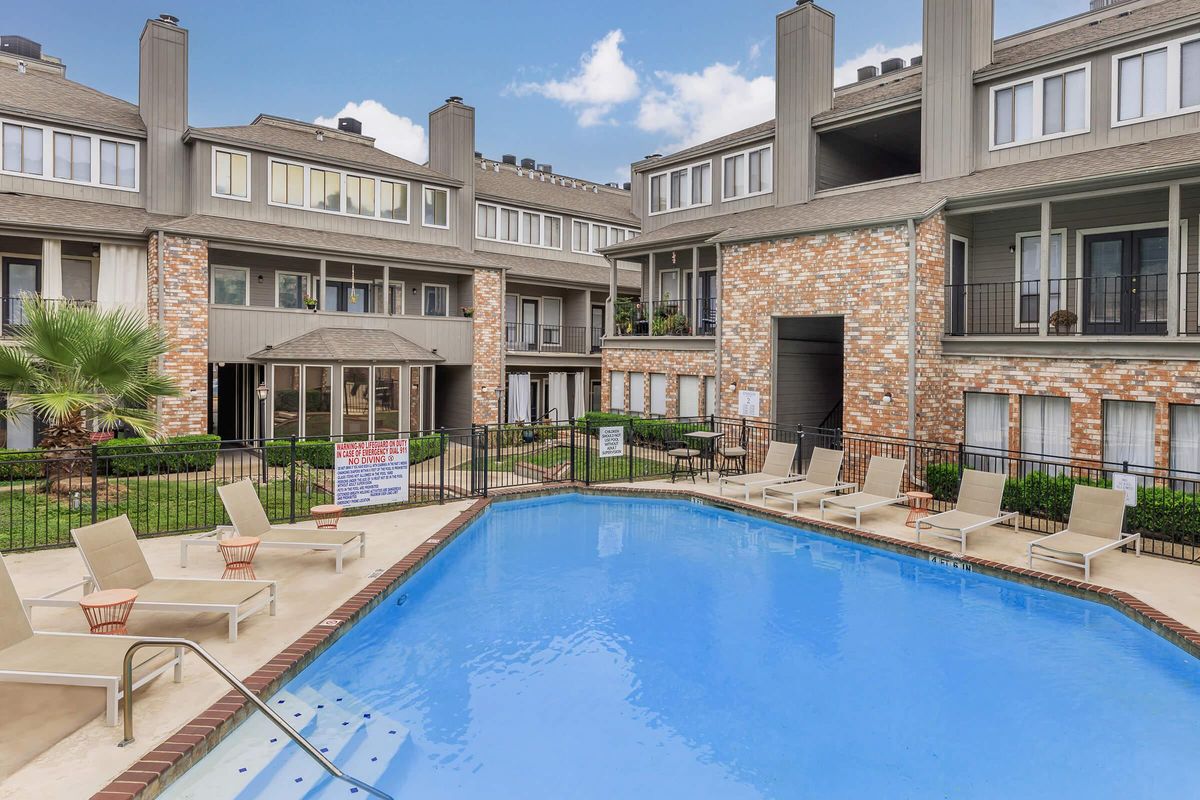 a large pool of water in front of a building