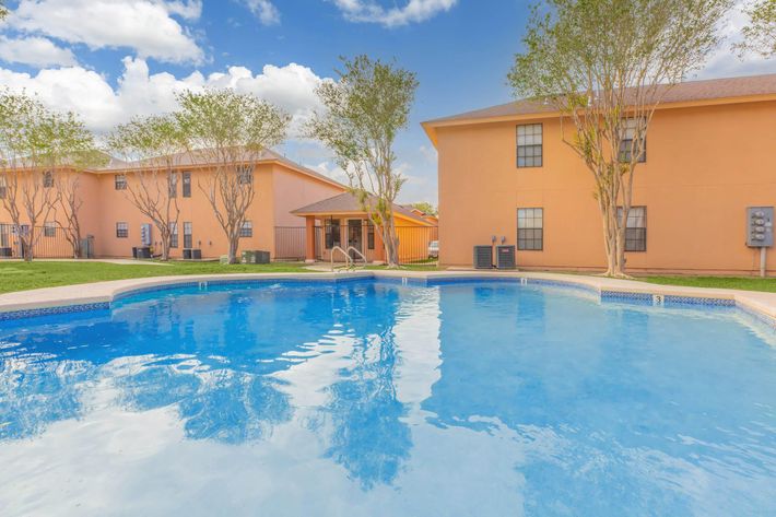 SPARKLING SWIMMING POOLS IN VILLAS LAREDO APARTMENTS FOR RENT.
