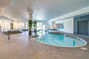 a room with a pool in front of a building