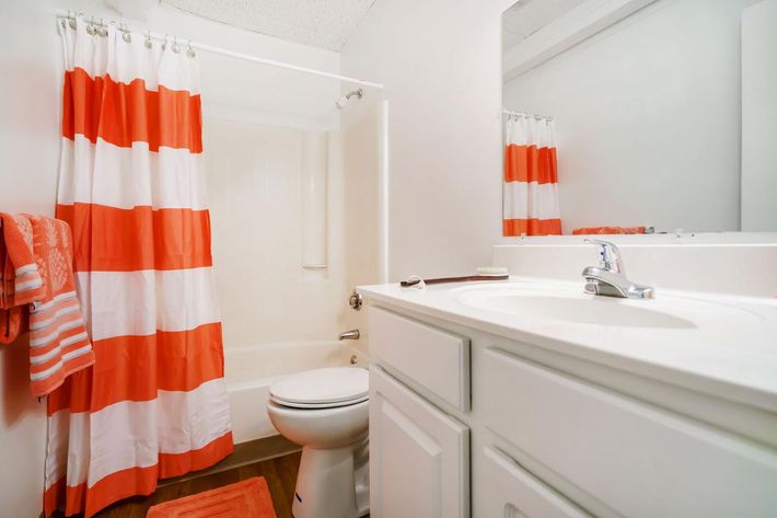 an orange and white shower curtain
