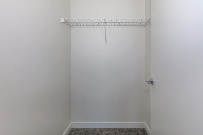 a white sink sitting next to a shower