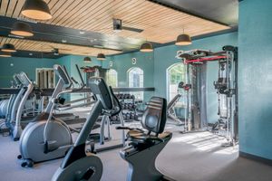Cardio and cable machines and rack of dumbbells in Fitness Center at Prisma in Albuquerque, NM