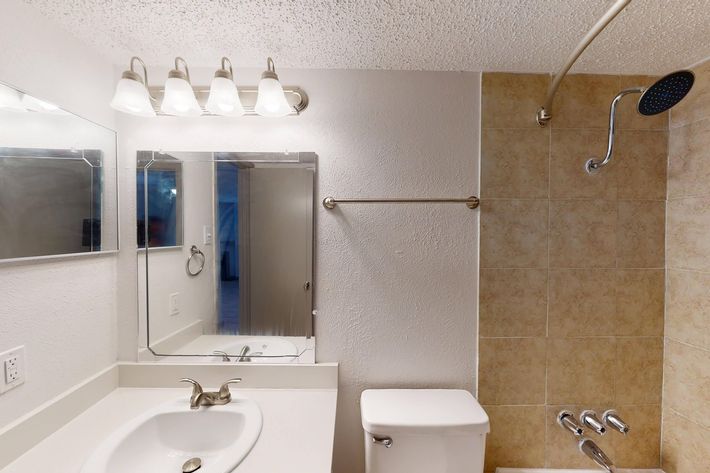 a restroom with a sink and a mirror