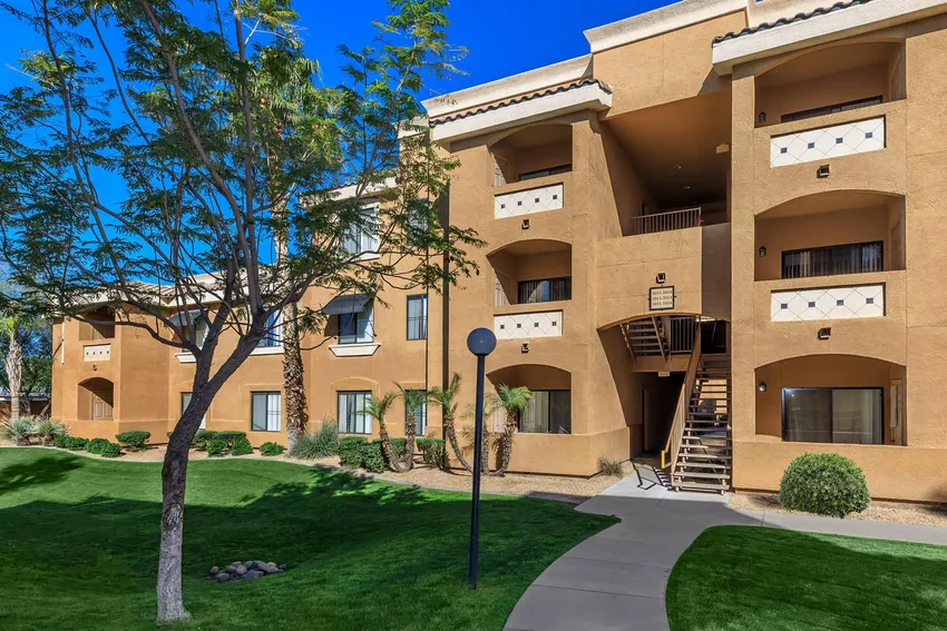 Building exterior at Colonia Del Sol Apartments.