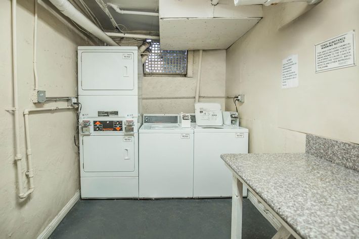 a kitchen with a sink and a refrigerator