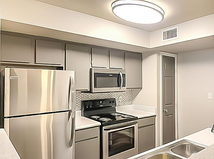 a modern kitchen with stainless steel appliances