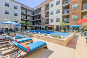 community pool with blue lounge chairs