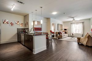 furnished kitchen and dining room with wooden floors
