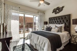 furnished bedroom with sliding glass doors